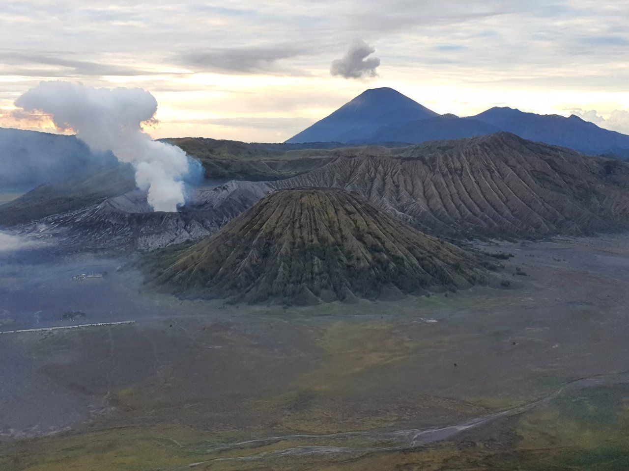 The grey sand sea stretching across the Tengger caldera below Mount Bromo