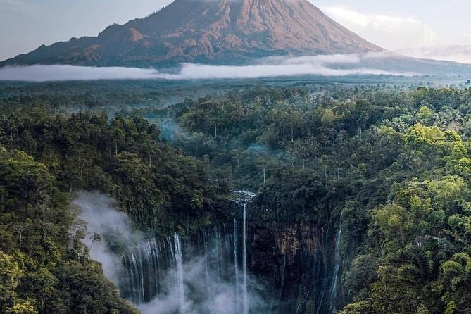 The curtain of falls at Tumpak Sewu dropping into its green amphitheatre